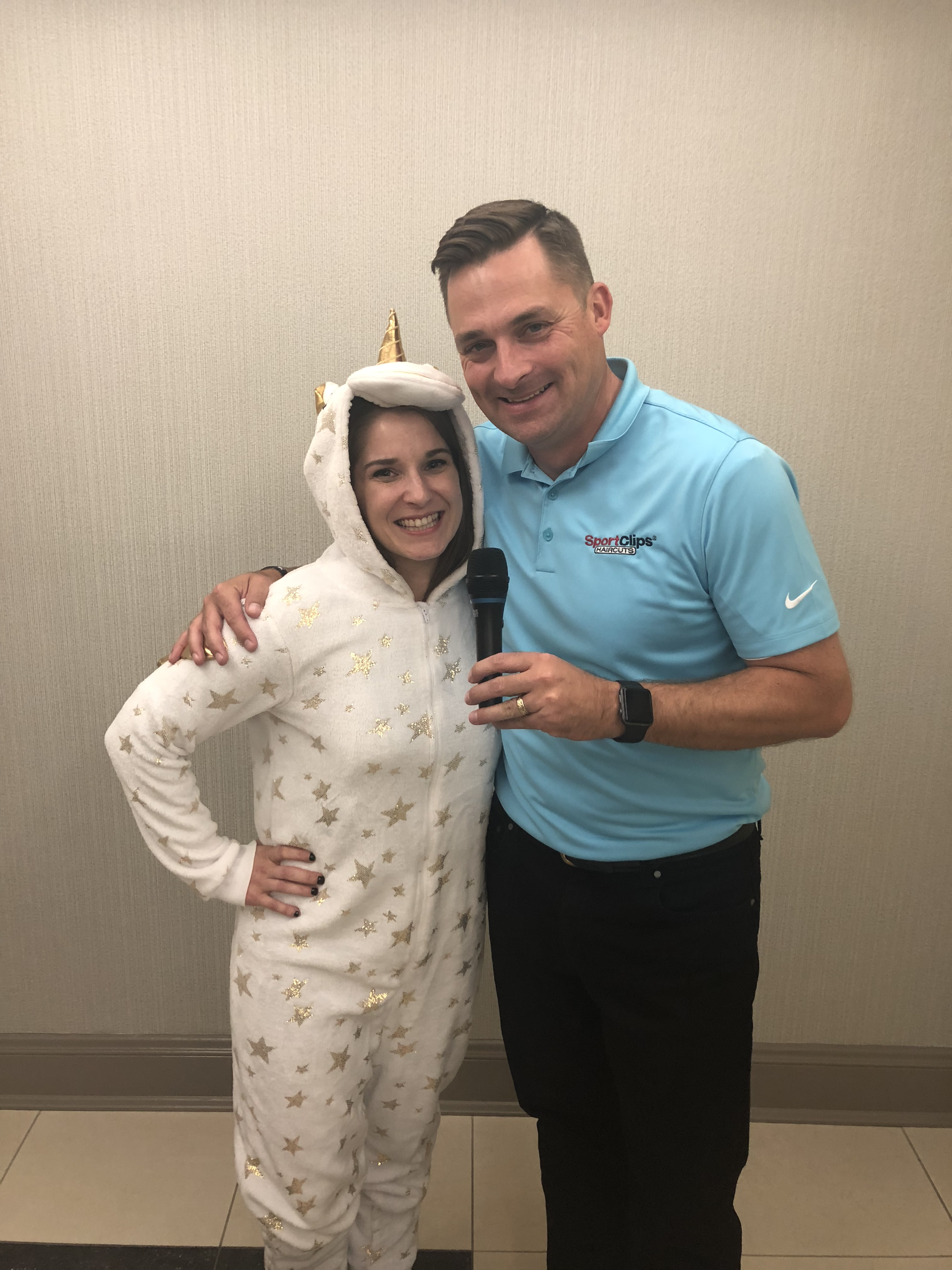 Chad with Microphone and Sara with Unicorn Costume